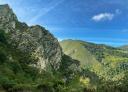 Rocky formations and imposing mountains in the natural surroundings of the Valgrande Forest.