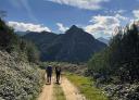 Pilgrims walking along a branch of the Camino de Santiago towards San Miguel del Río.
