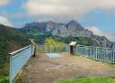 Viewpoint with metal railing in front of the Monsacro massif