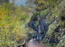 Hikers crossing rocky gorge on the Alba Route