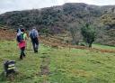Group of hikers on the path towards Collada Faisaldes
