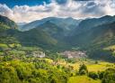 Panoramic view of Soto de Agues between green mountains.