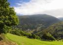 Panoramic view of the valley with a village in the background highlighting the green landscape.