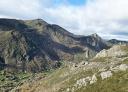 Panoramic view of the valley with a village in the distance between mountains.