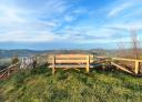 Rustic wooden bench with panoramic views of nature