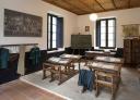 Interior of a rural school museum with traditional furnishings and cosy atmosphere