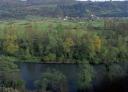 Aerial views of a river surrounded by lush greenery
