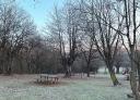 Picnic table in winter frost-covered park