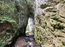 Narrow passage between rock cave walls