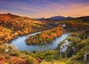 Panoramic view of a meandering river in a spectacular autumn-coloured sunset.