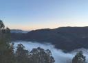 Spectacular sunrise with a sea of clouds covering the mountain valley.