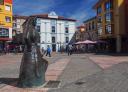 Square in Grado with ancient buildings and central statue