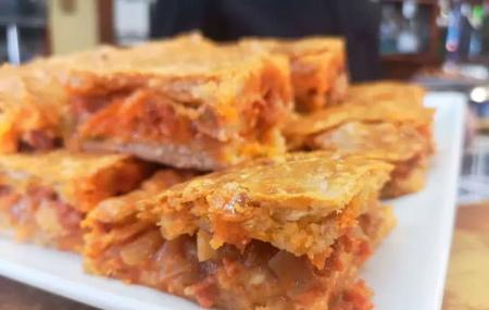 Trozo de empanada del Restaurante Blanco